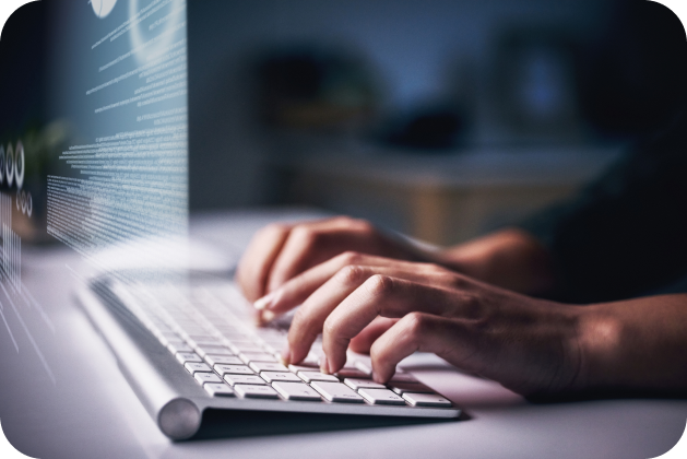 Hands typing on keyboard